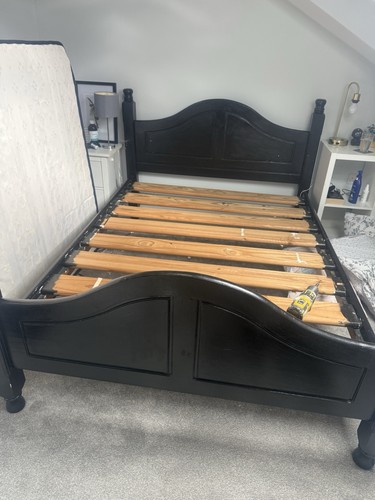Black wooden double - bed, frame